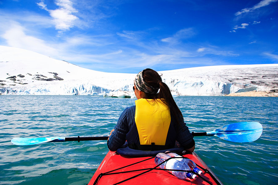 Sea kayak the icy water as you search for whales or polar bears