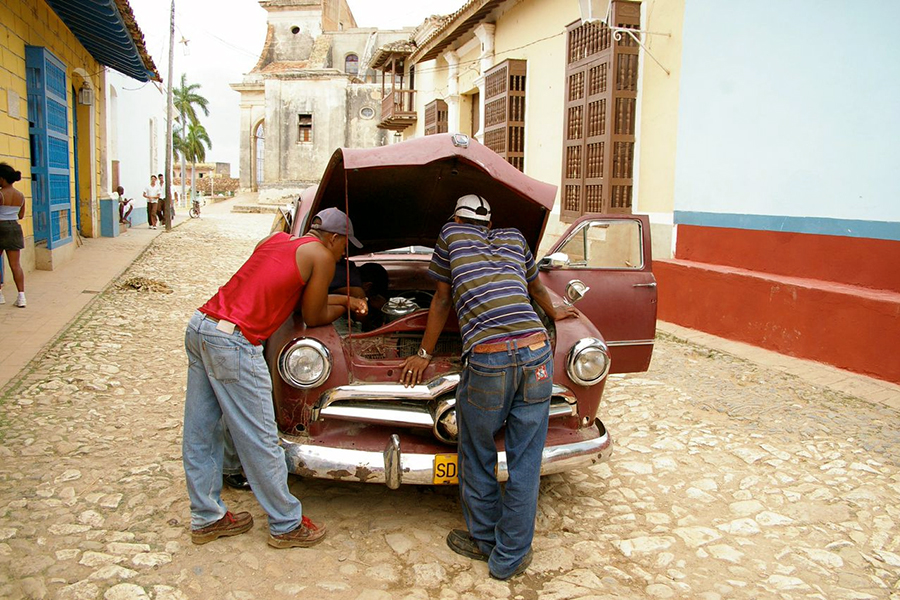 Trying to fix a car, Havana, Cuba