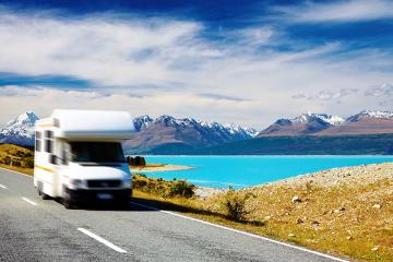 A motorhome driving by Mount Cook, New Zealand