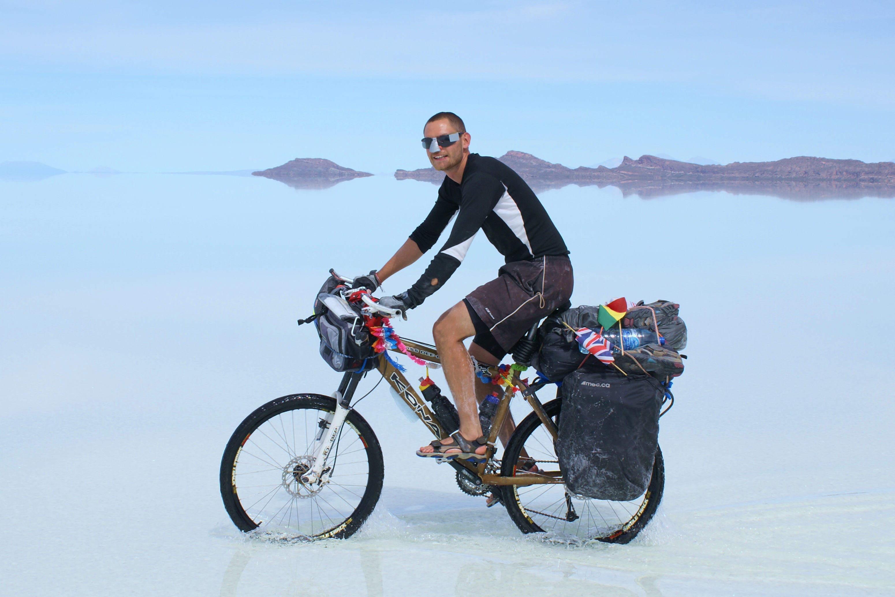 Chris cycling across the Uyuni salt flats in Bolivia