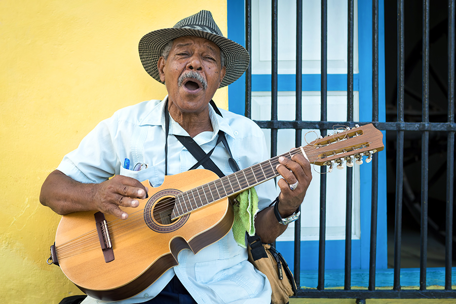 A local man playing guitar, Havana, Cuba | Cuba Travel Guide