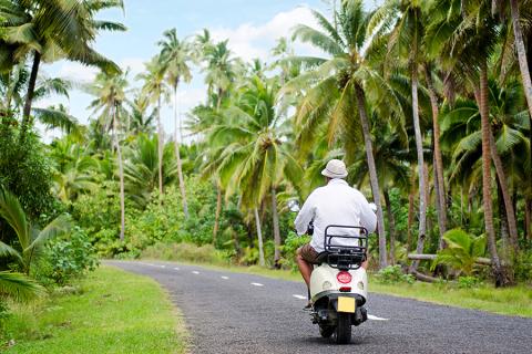 A man riding a moped, Cook Islands