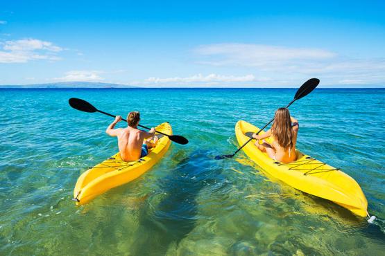 Kayak on the bright blue waters of Bora Bora lagoon | Travel Nation